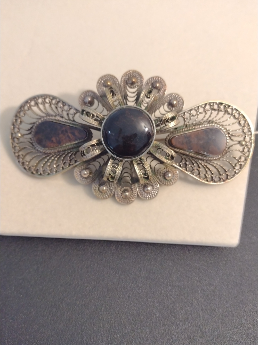 Silver Filigree Flower Brooch with Brown Stone Accent